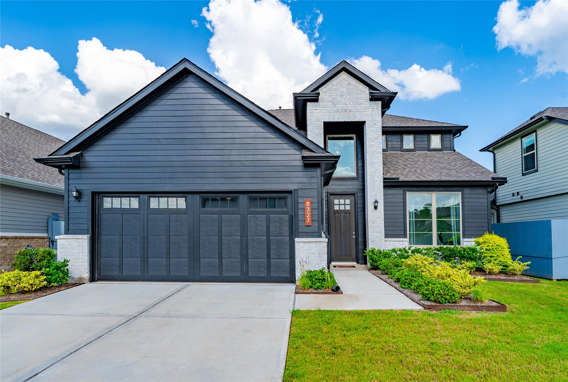 8327 Threadfin Way Fulshear, TX 77441 - Photo 11 of 40 a front view of a house with garden