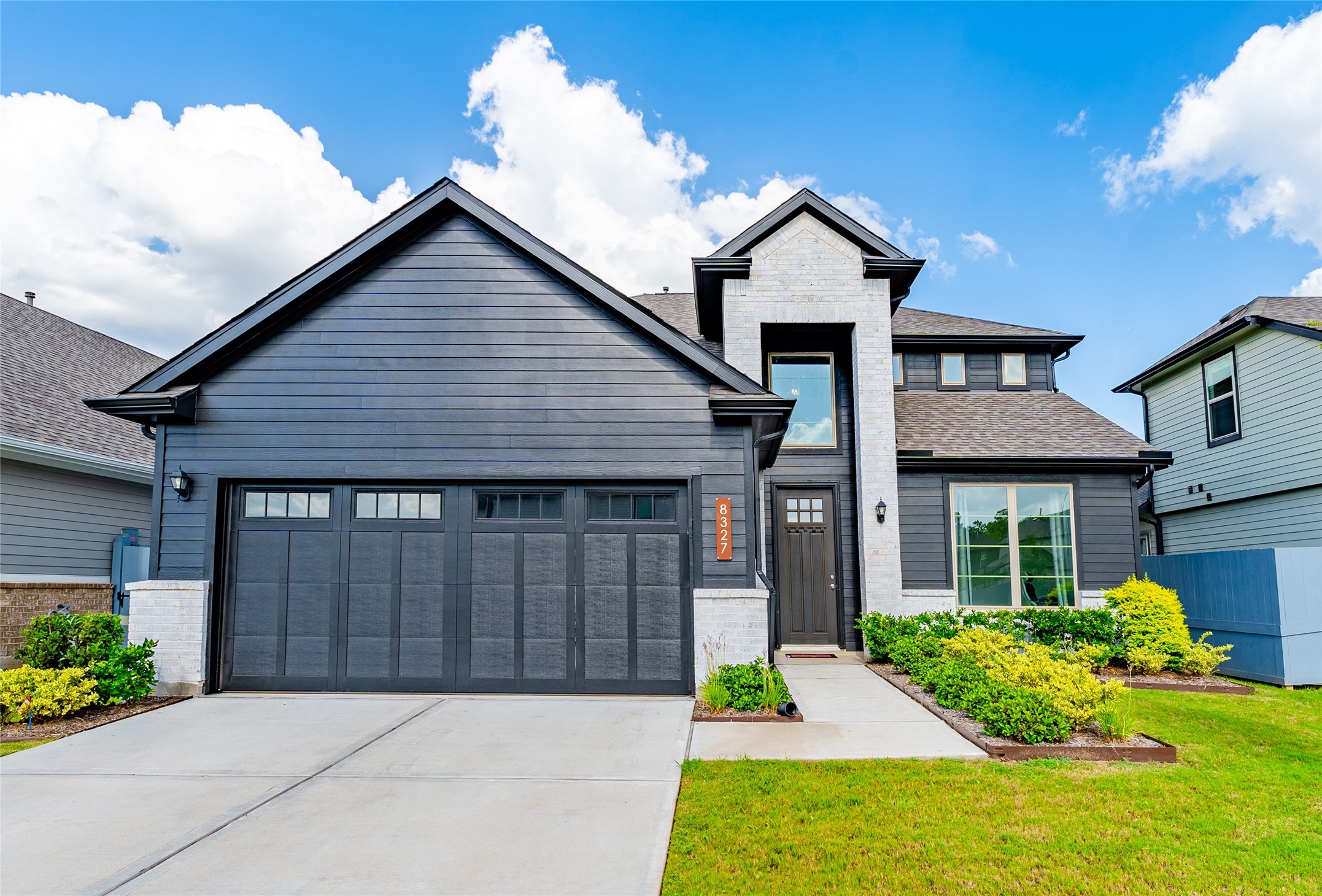 8327 Threadfin Way Fulshear, TX 77441 - Photo 12 of 40 a front view of a house with garden