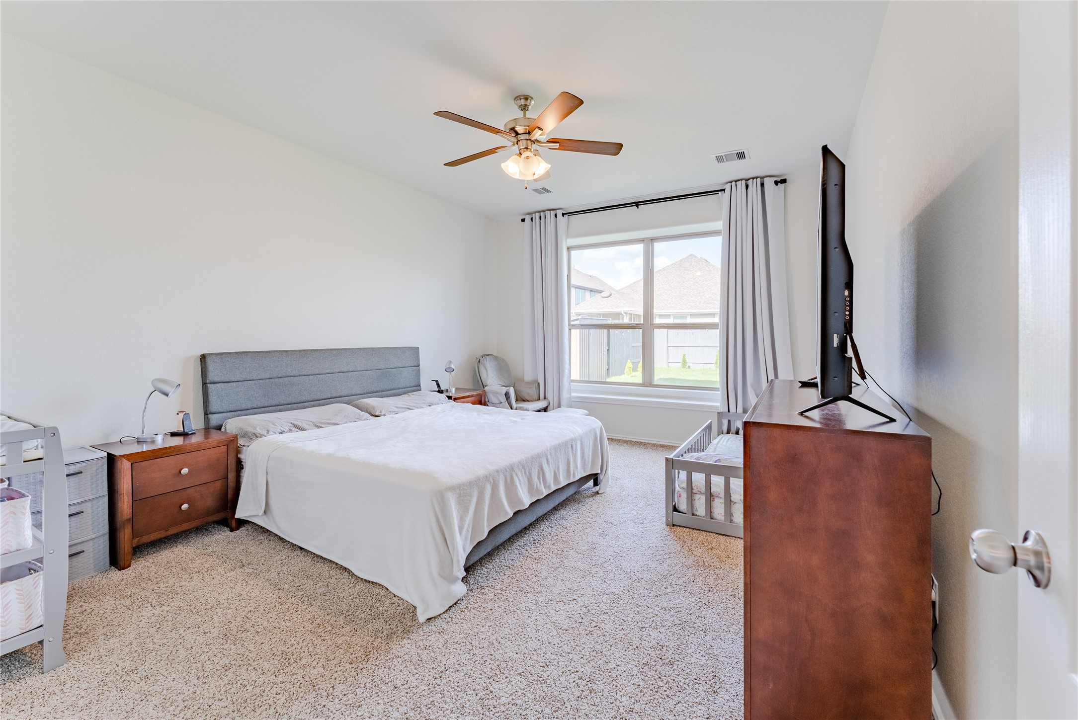 8327 Threadfin Way Fulshear, TX 77441 - Photo 20 of 40 a bedroom with a bed and window