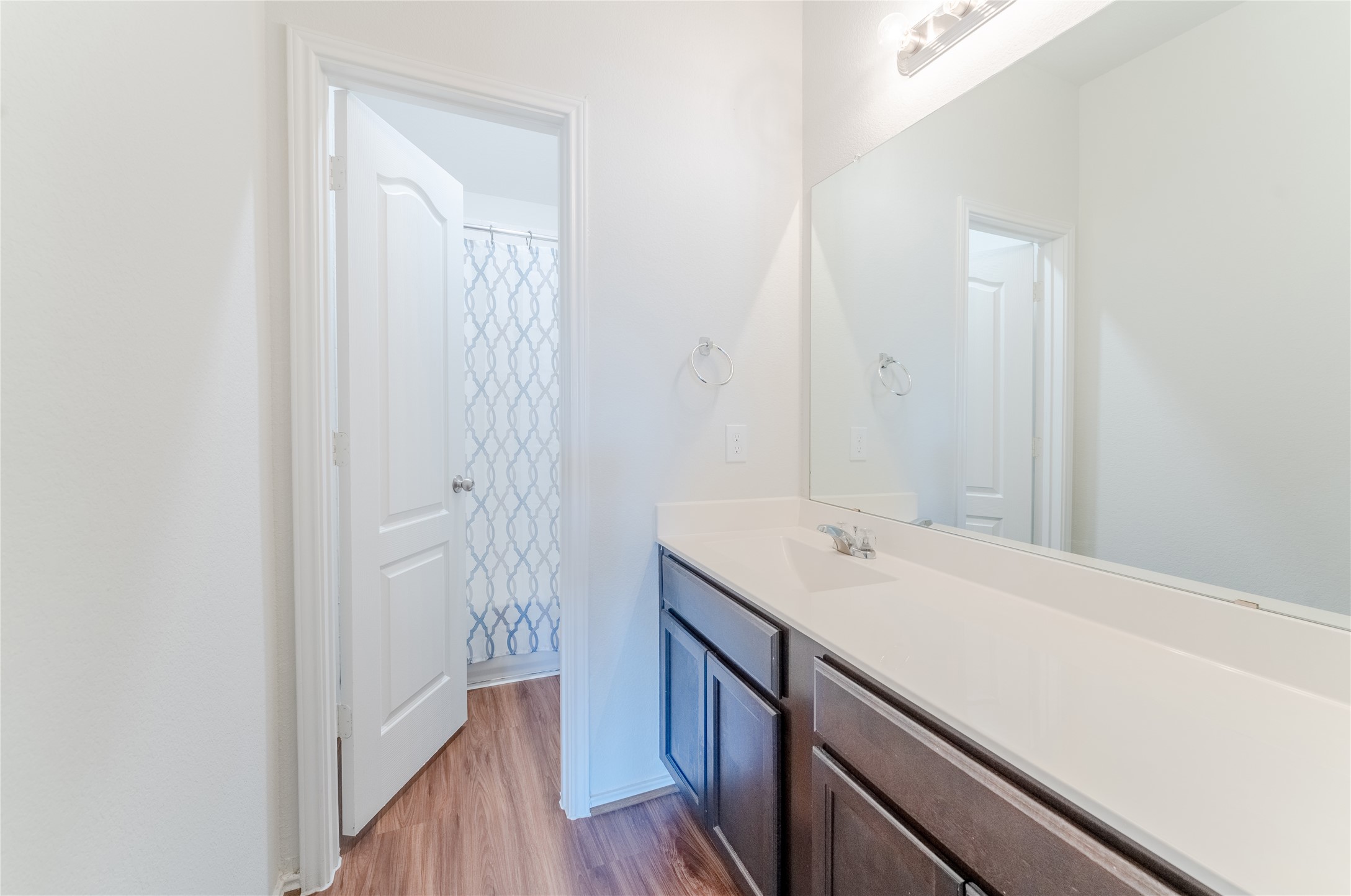 8327 Threadfin Way Fulshear, TX 77441 - Photo 27 of 40 a bathroom with a sink a mirror and a shower