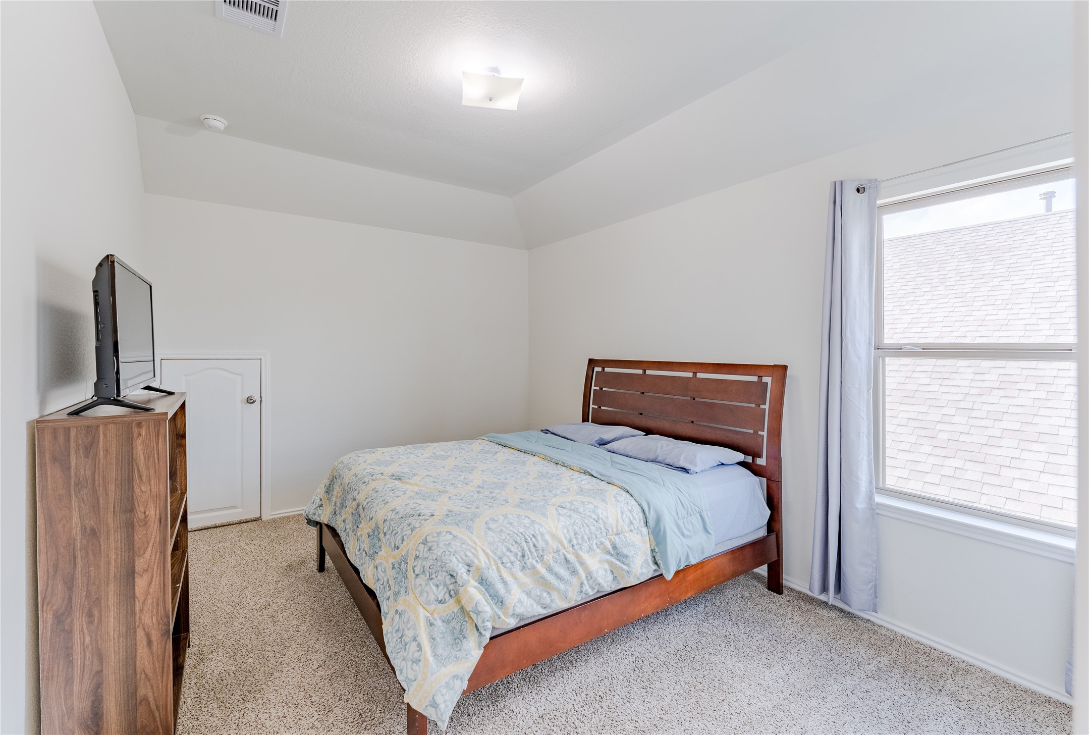 8327 Threadfin Way Fulshear, TX 77441 - Photo 27 of 40 a bedroom with bed and window