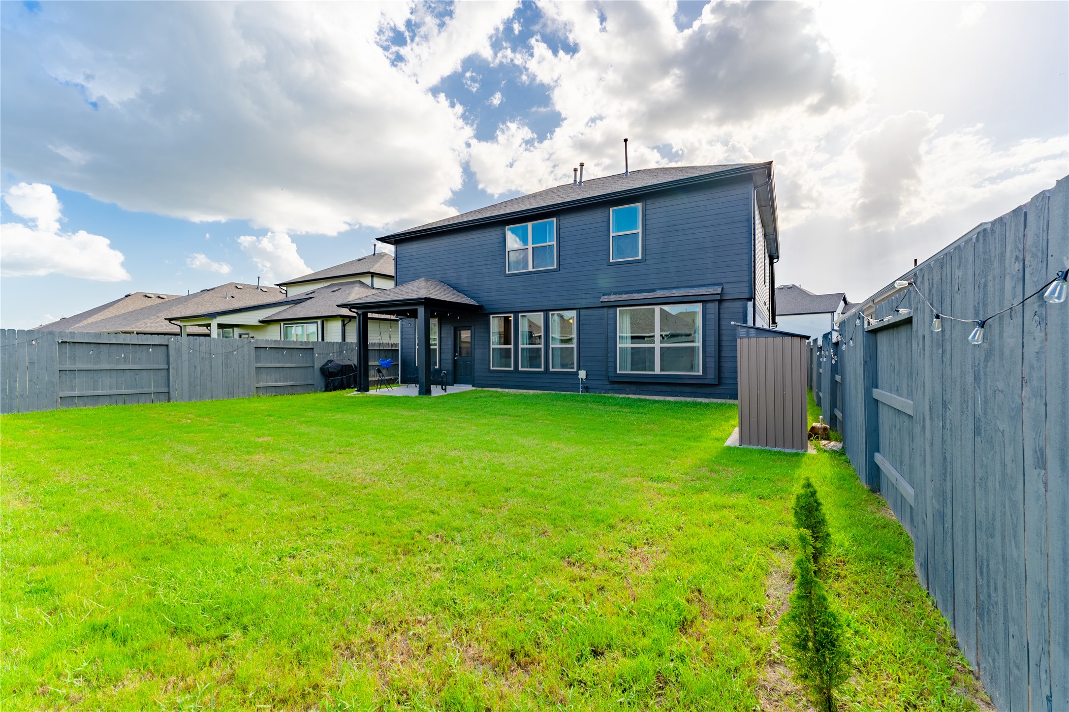 8327 Threadfin Way Fulshear, TX 77441 - Photo 31 of 40 a view of a house with a backyard