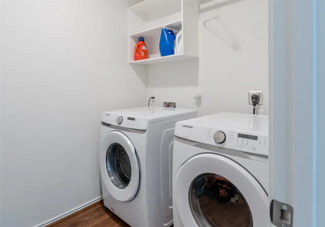 a view of an house with backyard and balcony