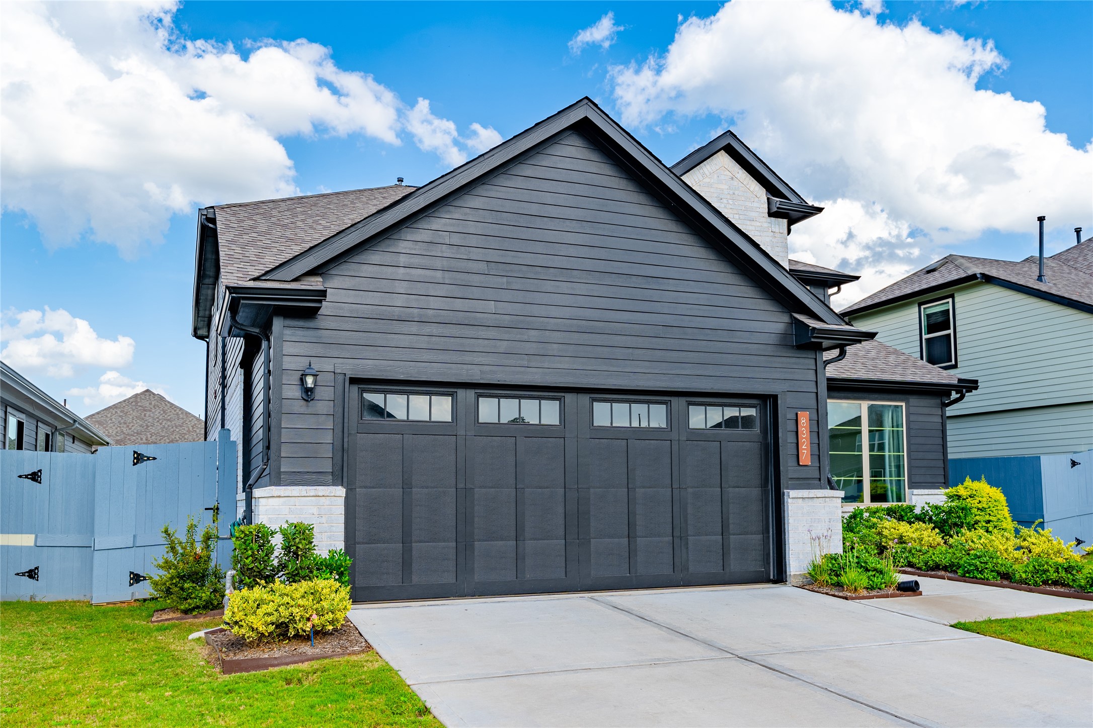 8327 Threadfin Way Fulshear, TX 77441 - Photo 38 of 40 a front view of a house with garden