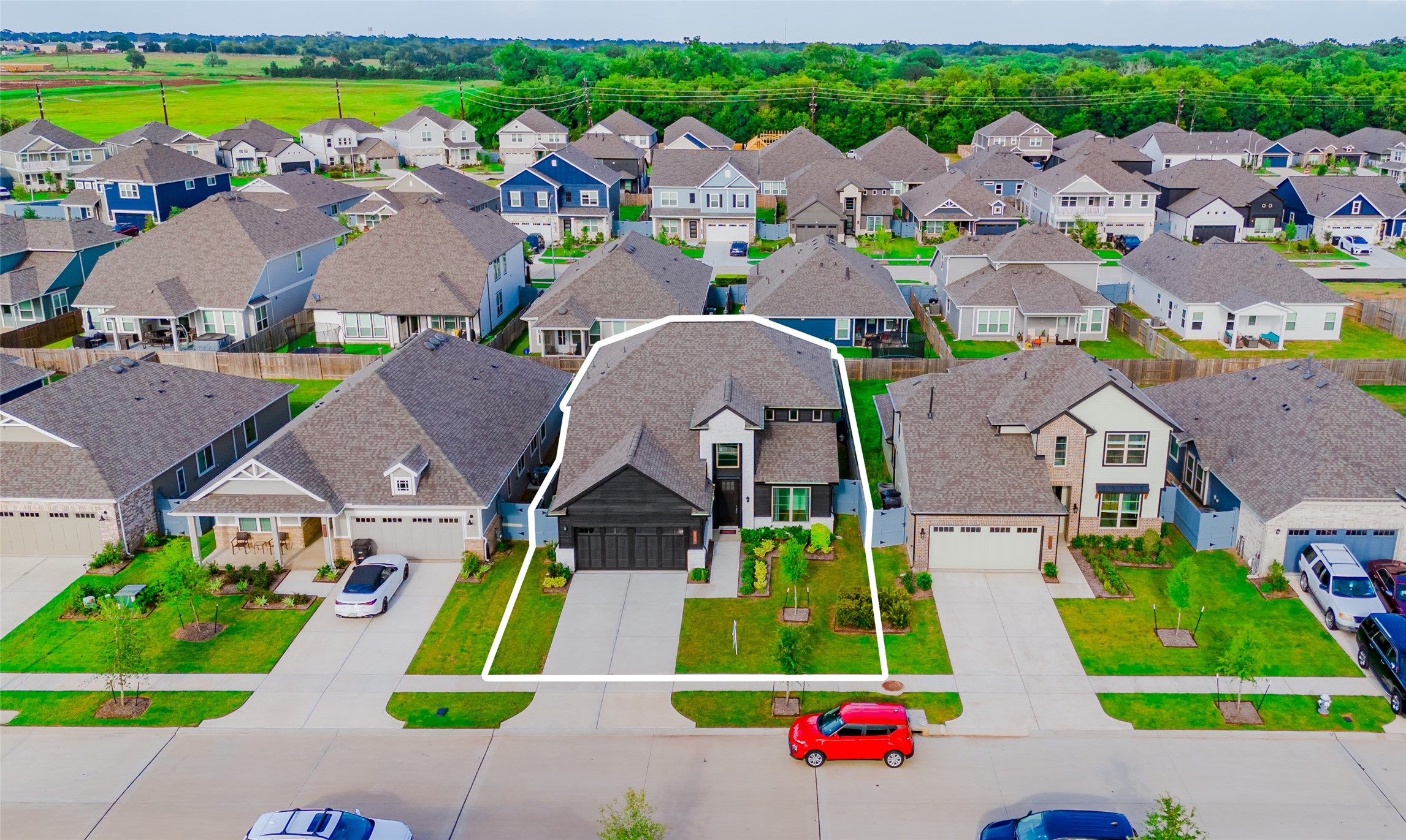 8327 Threadfin Way Fulshear, TX 77441 - Photo 39 of 40 an aerial view of multiple houses with yard