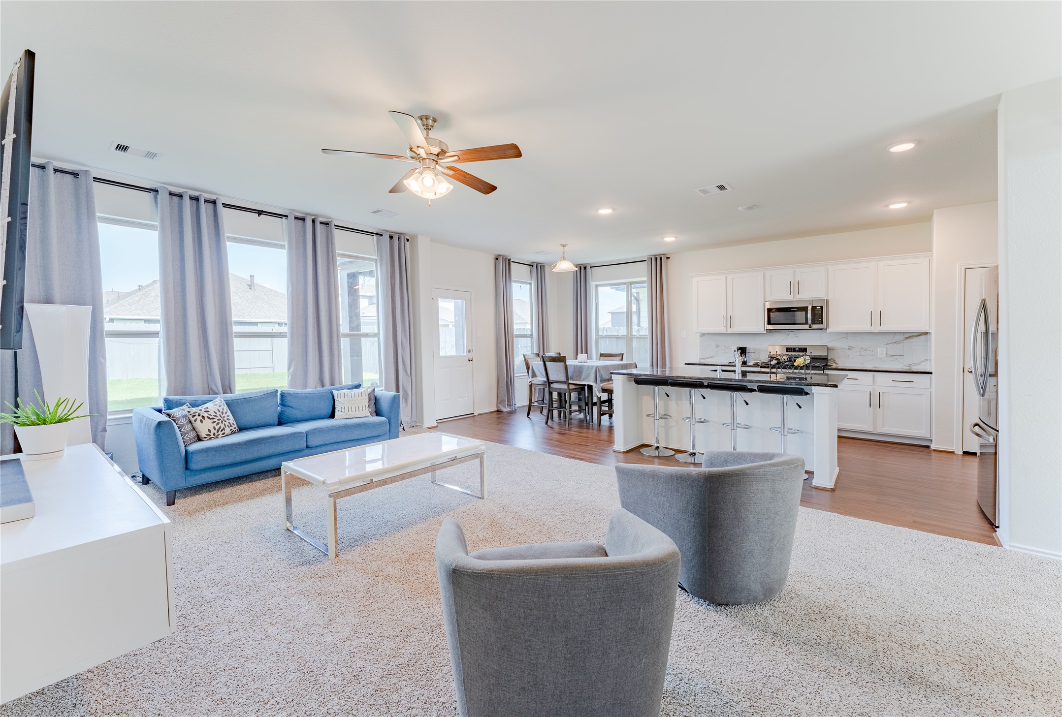 8327 Threadfin Way Fulshear, TX 77441 - Photo 5 of 40 a living room with furniture and a large window