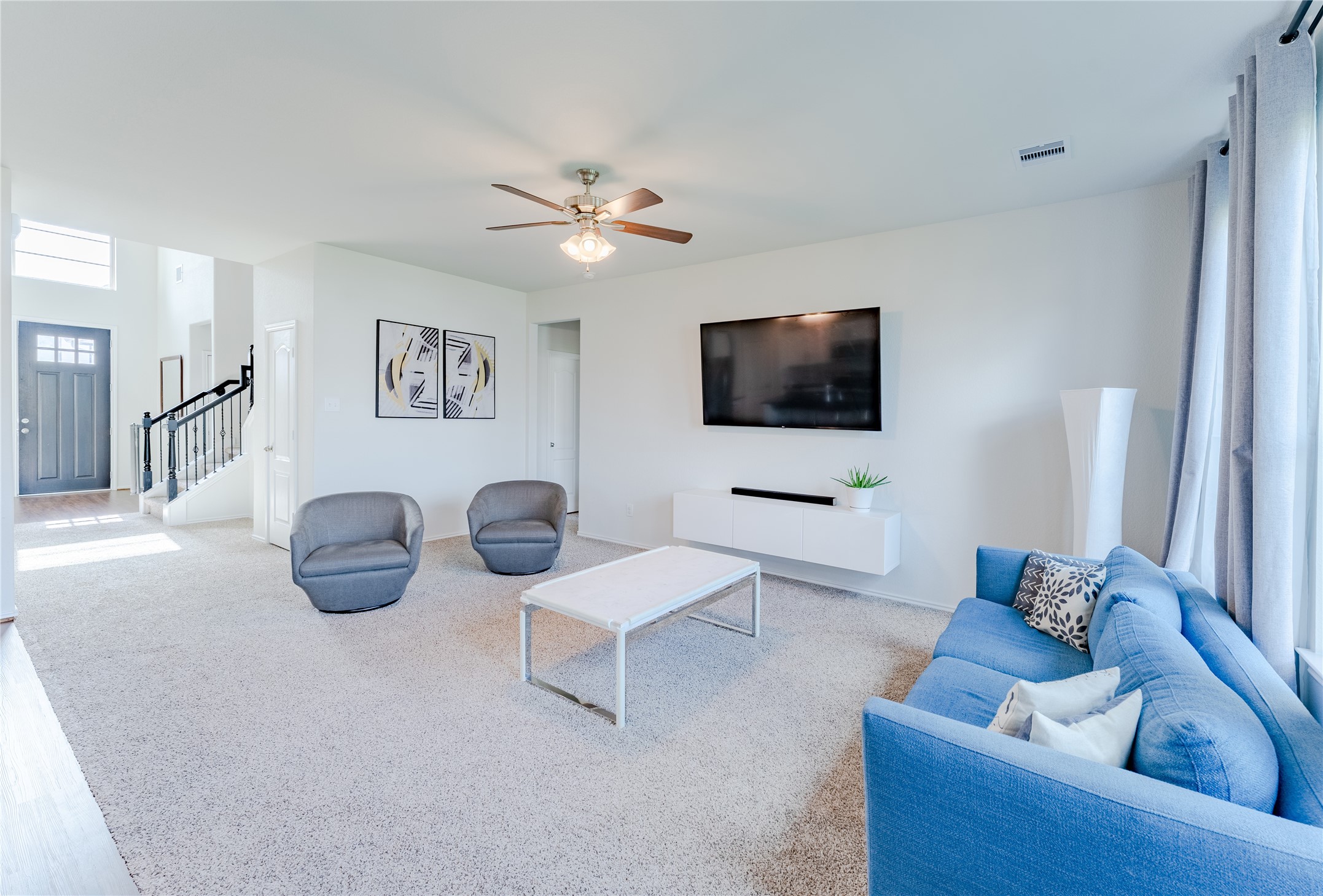 8327 Threadfin Way Fulshear, TX 77441 - Photo 5 of 40 a living room with furniture and a flat screen tv