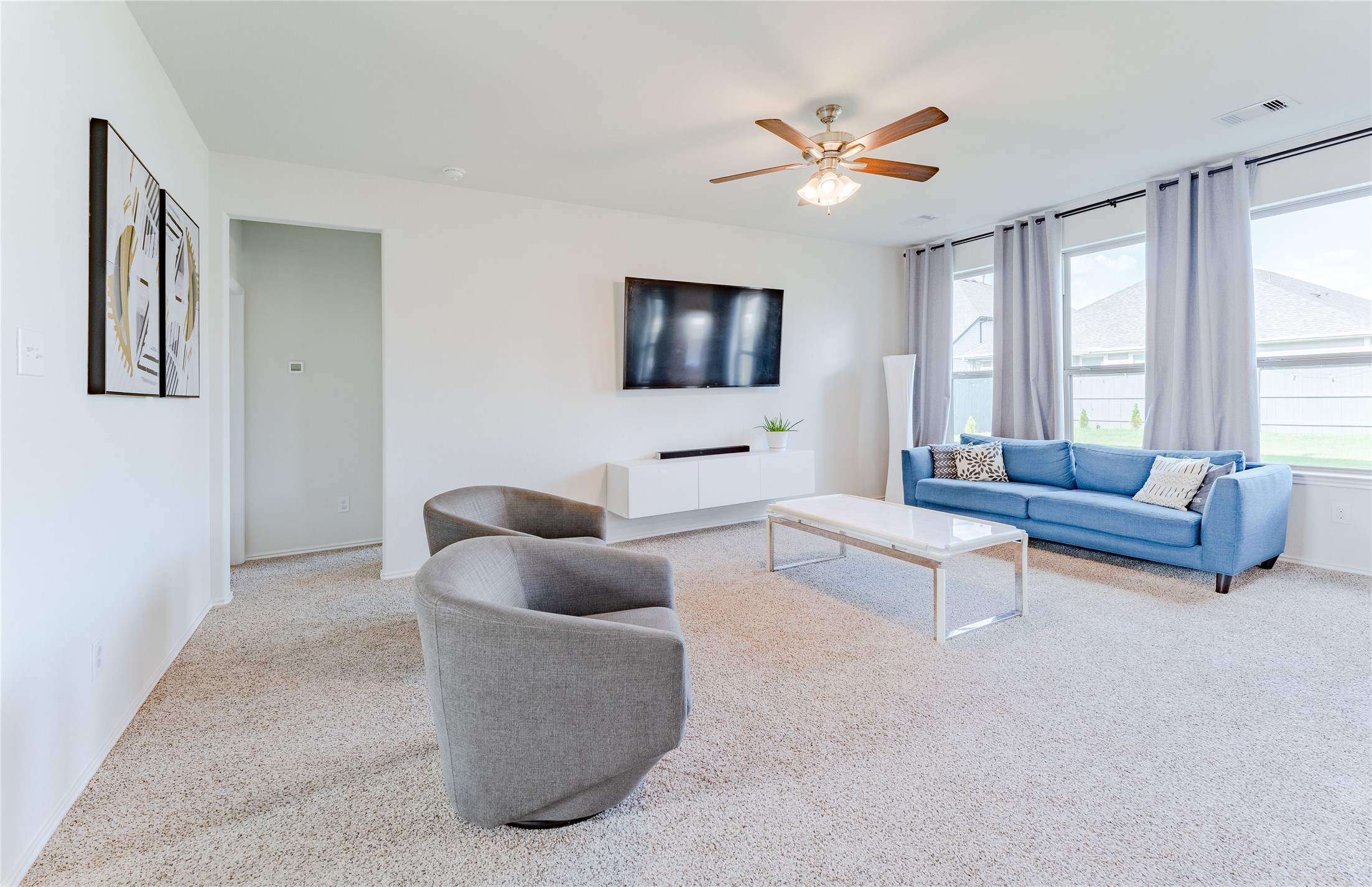 8327 Threadfin Way Fulshear, TX 77441 - Photo 6 of 40 a living room with furniture and a flat screen tv