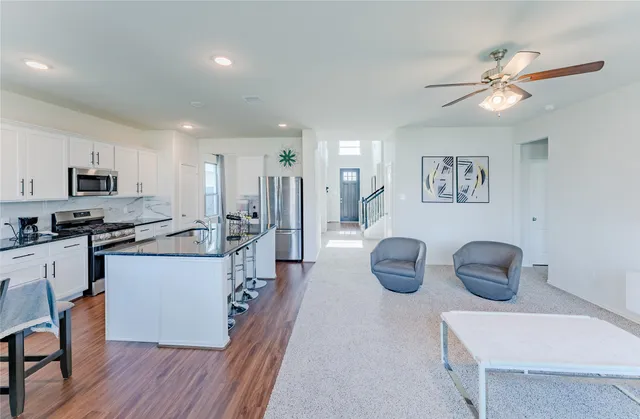 a kitchen with counter space cabinets and appliances