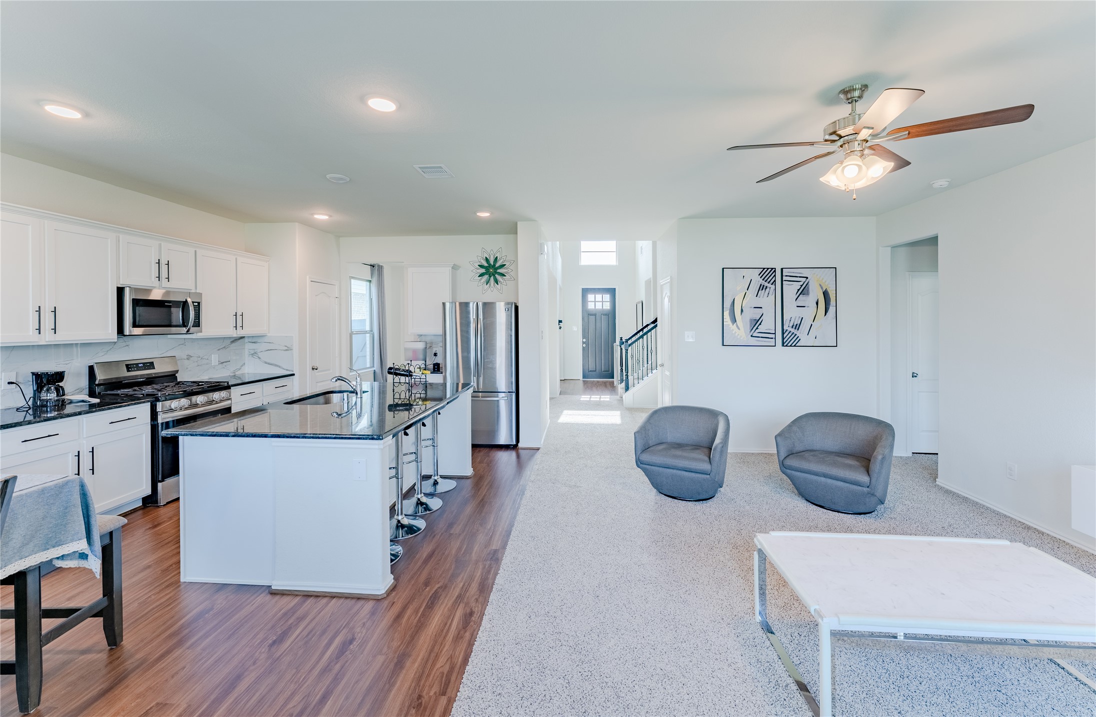 8327 Threadfin Way Fulshear, TX 77441 - Photo 10 of 40 a kitchen with counter space cabinets and appliances