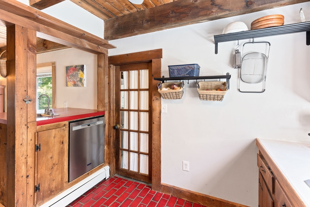 1020 Old Falmouth Road Barnstable, MA 02632 - Photo 19 of 42 a view of a hallway with wooden floor and staircase