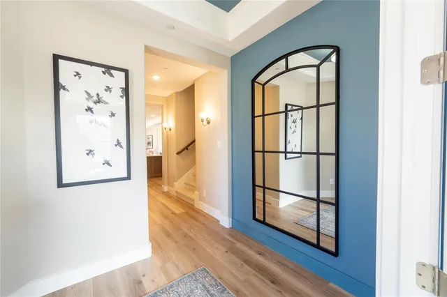 a bedroom with bed and a chandelier