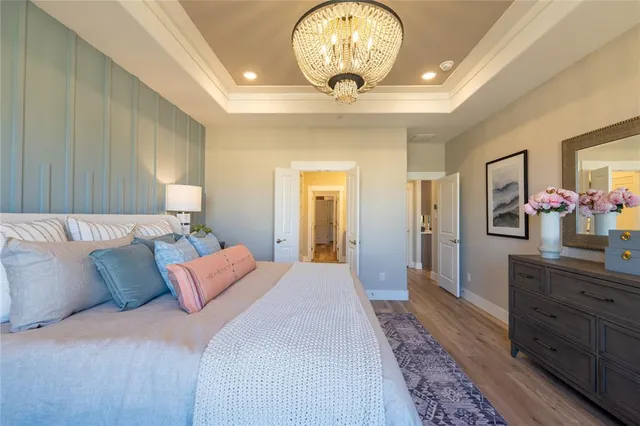 a bathroom with a double vanity sink mirror and next to a window