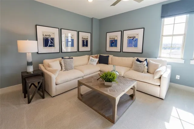 a living room with furniture a window and gym equipment