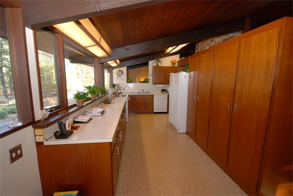 128 Pope Road Acton, MA 01720 - Photo 2 of 13 a dining room with furniture and a flat screen tv