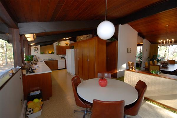128 Pope Road Acton, MA 01720 - Photo 3 of 13 a kitchen with a dining table chairs sink and granite counter top