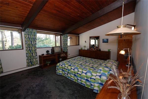 128 Pope Road Acton, MA 01720 - Photo 6 of 13 a bedroom with a bed dresser and a large window