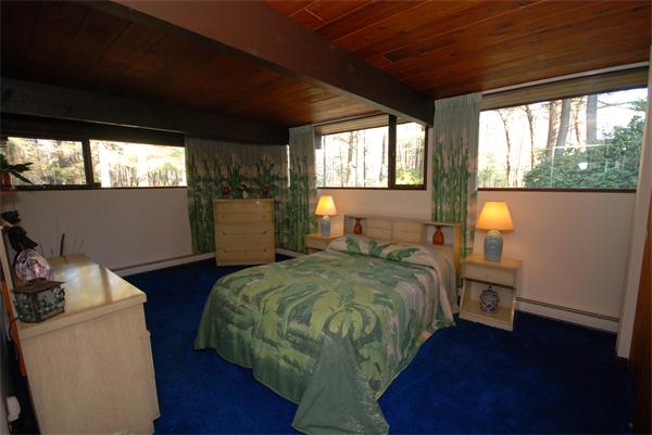 128 Pope Road Acton, MA 01720 - Photo 7 of 13 a bedroom with a bed and a window