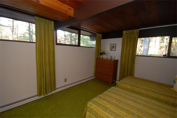 128 Pope Road Acton, MA 01720 - Photo 8 of 13 a bedroom with a bed and wooden floor