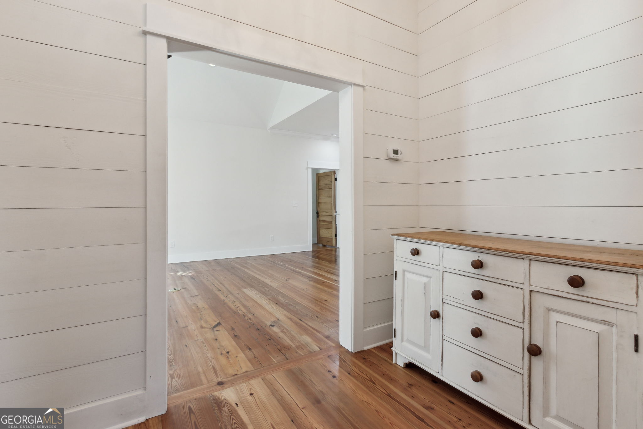 711 Wheeler Street St. Marys, GA 31558 - Photo 11 of 93 a view of a dresser with wooden floor