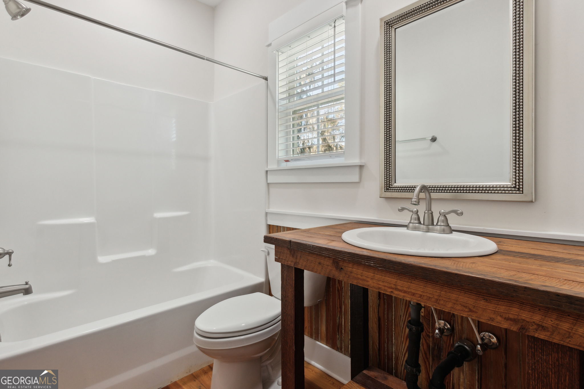 711 Wheeler Street St. Marys, GA 31558 - Photo 30 of 93 a bathroom with a sink a toilet and a bathtub