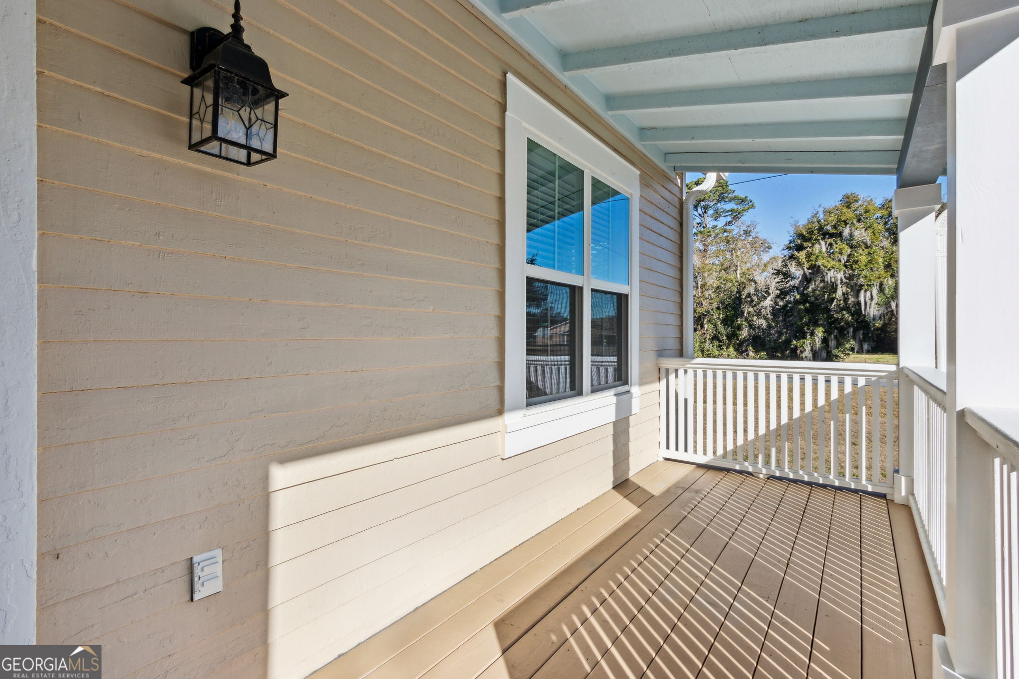 711 Wheeler Street St. Marys, GA 31558 - Photo 6 of 93 a view of a balcony with wooden floor