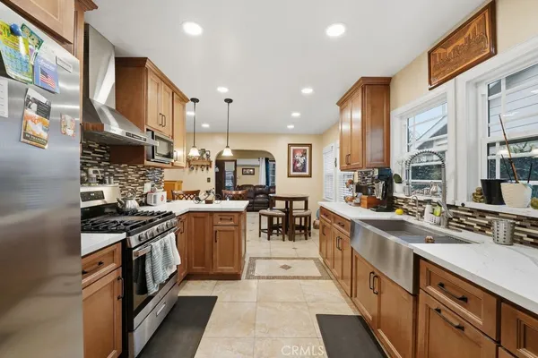 a kitchen with stainless steel appliances granite countertop lots of counter top space