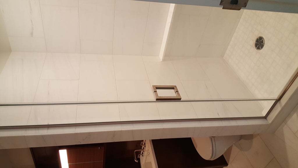 60 Riverside Boulevard, Unit 810 Manhattan, NY 10069 - Photo 9 of 11 a bathroom with a shower and toilet