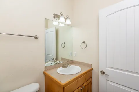 a view of a bathroom from a hallway