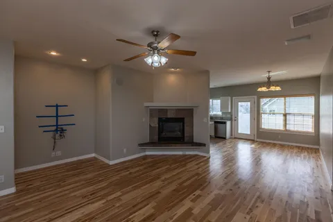 a kitchen with stainless steel appliances granite countertop a refrigerator sink and stove