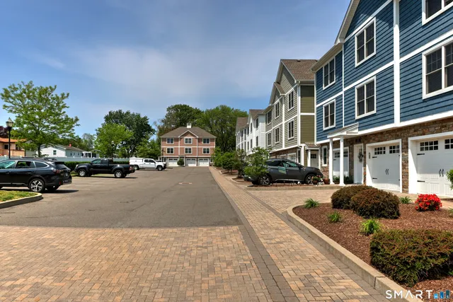 a city street lined with buildings and cars