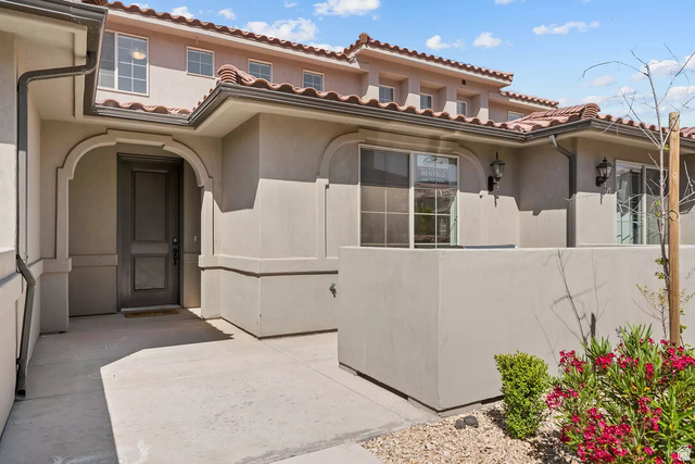 1166 North Riviera Alley Washington, UT 84780 - Photo 18 of 26 View of exterior entry featuring stucco siding and a tiled roof
