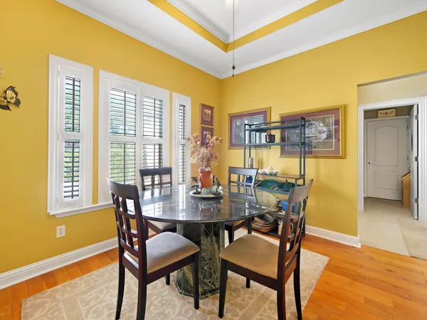 a view of a dining room with furniture and a window