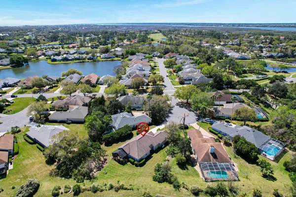 an aerial view of lake and houses with outdoor space