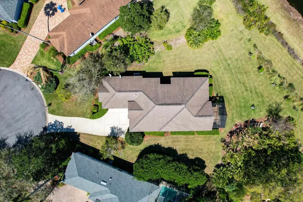 an aerial view of residential house with an outdoor space