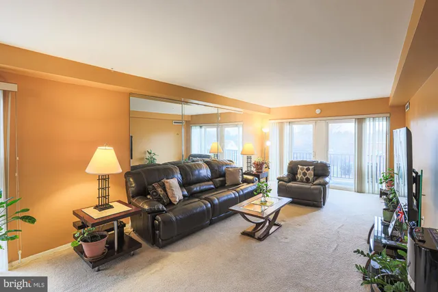 a living room with furniture and a table