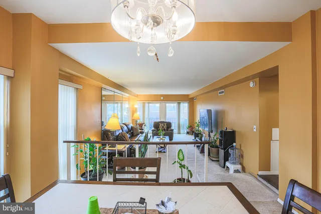 a room with lots of table and chairs