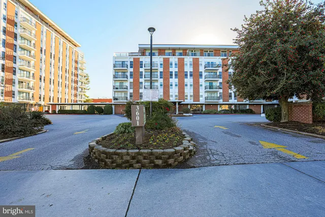 a front view of building with garden