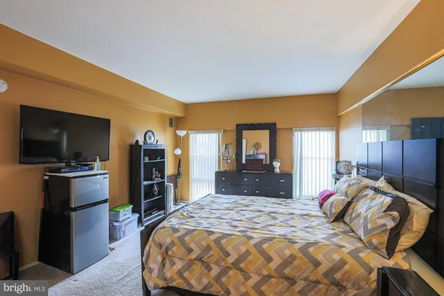 a bedroom with a bed and furniture