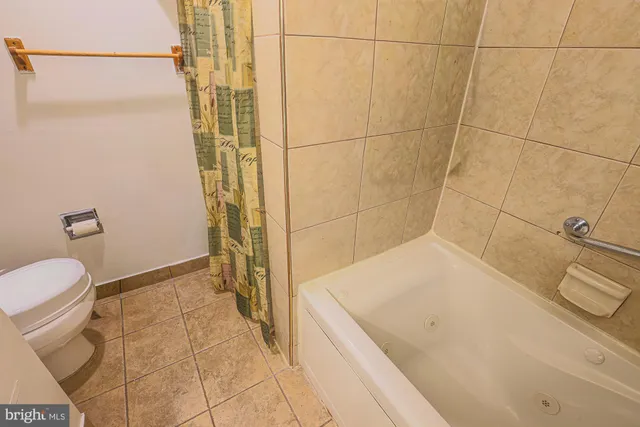 a view of a livingroom with furniture and a flat screen tv