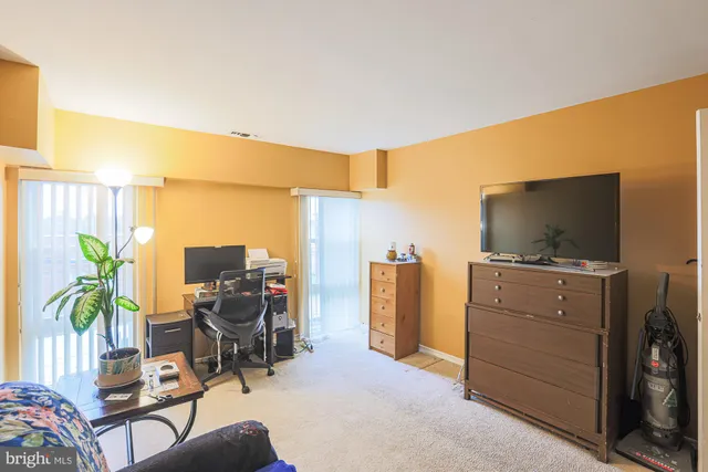 a view of living room with furniture and a flat screen tv