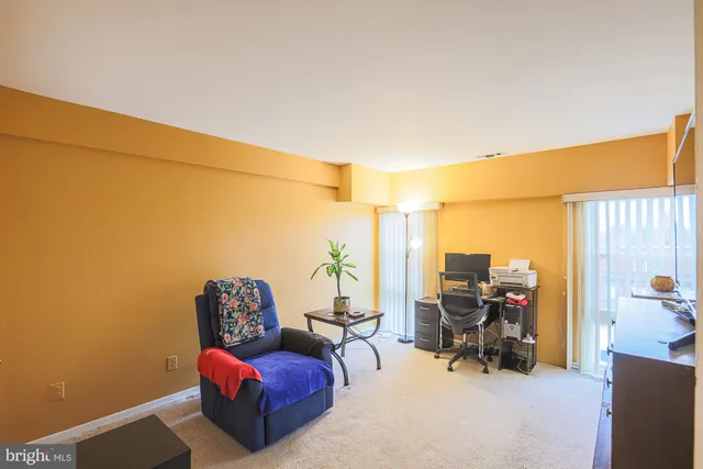 a view of a hallway with a livingroom