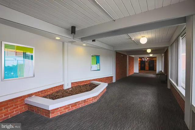 a view of gallery with wooden floor