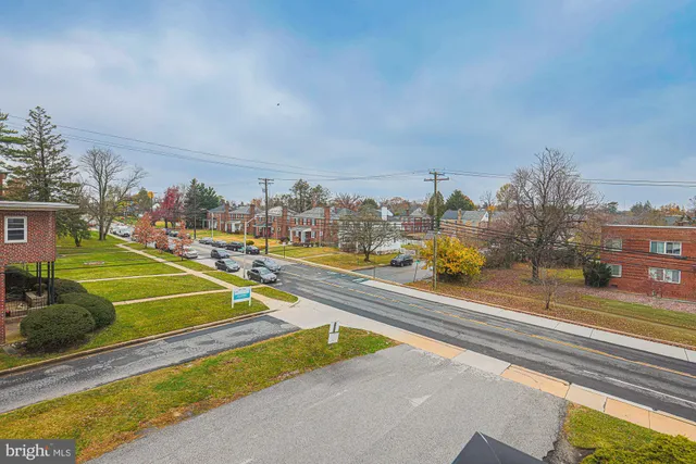 a view of a swimming pool with a lawn chairs