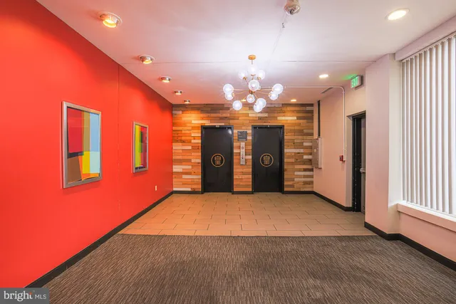 a living room with stainless steel appliances kitchen island granite countertop furniture and a kitchen view