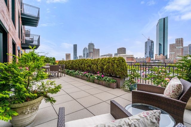a view of a terrace with couches and potted plants