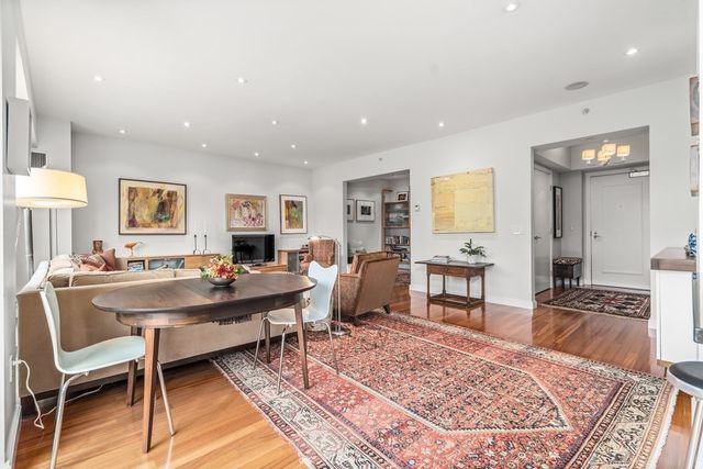 a living room with furniture and a table