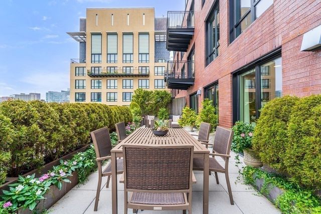 a view of a patio with couches and table and chairs