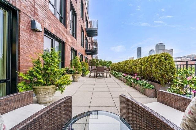 a view of a terrace with sitting area
