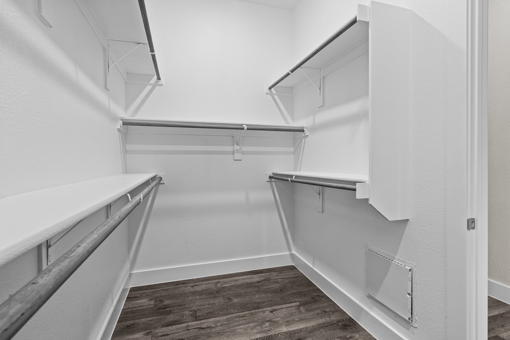 865 Limmer Loop, Unit 1014 Hutto, TX 78634 - Photo 26 of 37 a view of walk in closet with empty racks